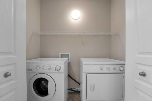9 Cimarron Vista Gardens, Okotoks, AB - Indoor Photo Showing Laundry Room