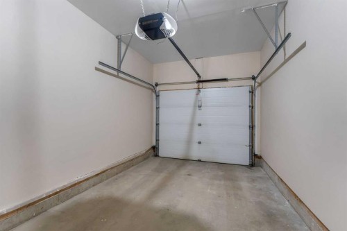 9 Cimarron Vista Gardens, Okotoks, AB - Indoor Photo Showing Garage