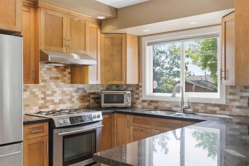 351 Queen Charlotte Road Se, Calgary, AB - Indoor Photo Showing Kitchen With Double Sink