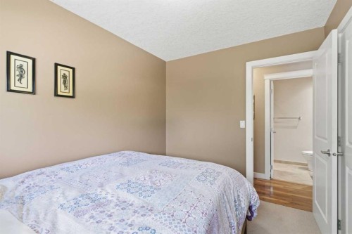 351 Queen Charlotte Road Se, Calgary, AB - Indoor Photo Showing Bedroom