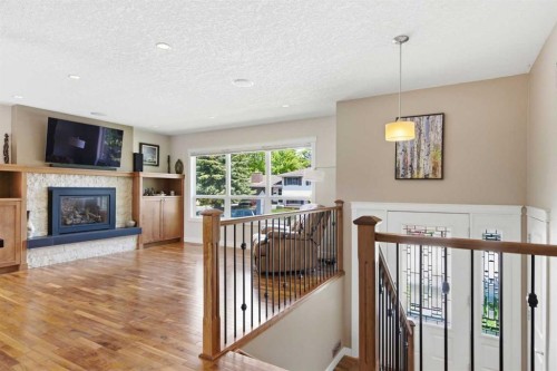 351 Queen Charlotte Road Se, Calgary, AB - Indoor With Fireplace