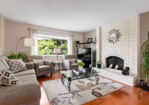 332 Pinemont Road Ne, Calgary, AB - Indoor Photo Showing Living Room With Fireplace
