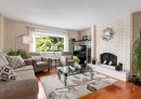 332 Pinemont Road Ne, Calgary, AB  - Indoor Photo Showing Living Room With Fireplace 