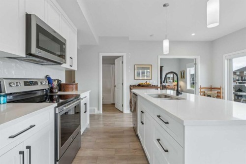 284 Canals Crossing Sw, Airdrie, AB - Indoor Photo Showing Kitchen With Double Sink With Upgraded Kitchen