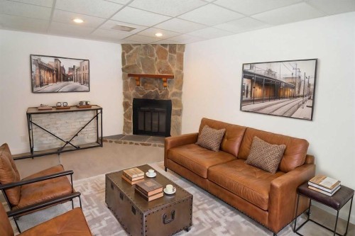 235 Avonburn Road Se, Calgary, AB - Indoor Photo Showing Living Room With Fireplace