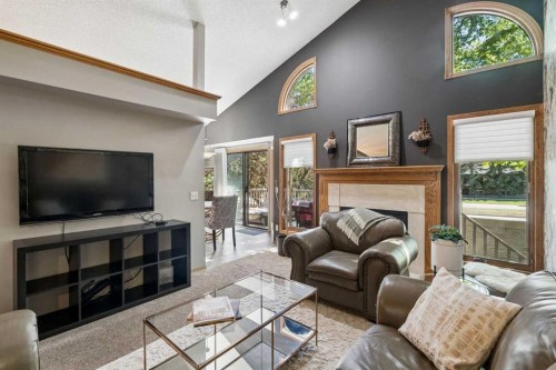 112 Oakbriar Close Sw, Calgary, AB - Indoor Photo Showing Living Room With Fireplace