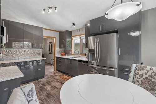 112 Oakbriar Close Sw, Calgary, AB - Indoor Photo Showing Kitchen With Stainless Steel Kitchen With Double Sink