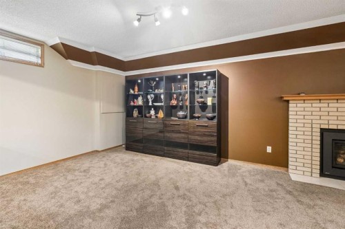 112 Oakbriar Close Sw, Calgary, AB - Indoor With Fireplace