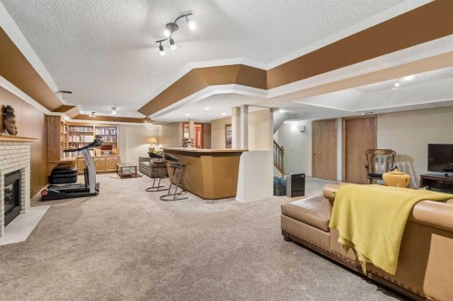 112 Oakbriar Close Sw, Calgary, AB - Indoor With Fireplace