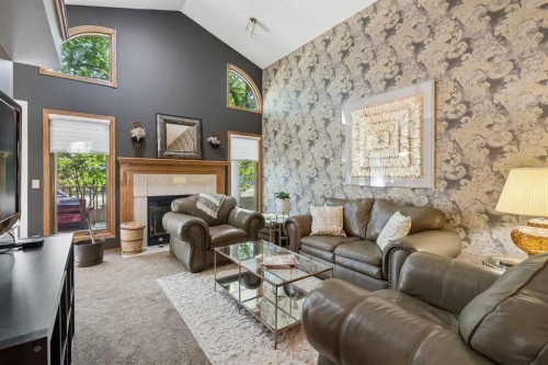 112 Oakbriar Close Sw, Calgary, AB - Indoor Photo Showing Living Room With Fireplace