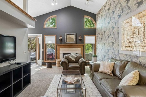 112 Oakbriar Close Sw, Calgary, AB - Indoor Photo Showing Living Room With Fireplace