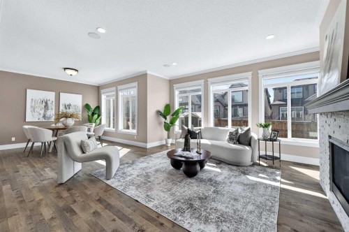 248 Marquis Landing Se, Calgary, AB - Indoor Photo Showing Living Room With Fireplace