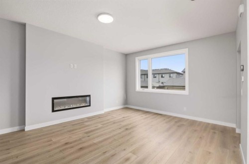43 Belvedere Crescent Se, Calgary, AB - Indoor Photo Showing Living Room With Fireplace