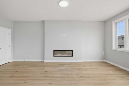 43 Belvedere Crescent Se, Calgary, AB - Indoor Photo Showing Other Room With Fireplace