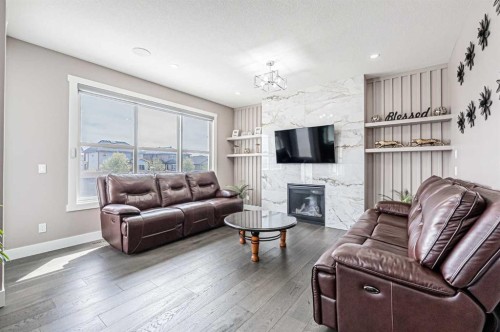 7 Waterford Heights, Chestermere, AB - Indoor Photo Showing Living Room With Fireplace
