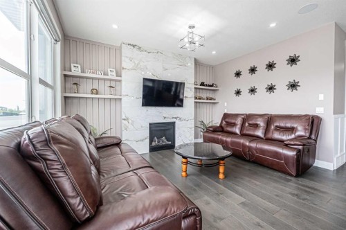7 Waterford Heights, Chestermere, AB - Indoor Photo Showing Living Room With Fireplace