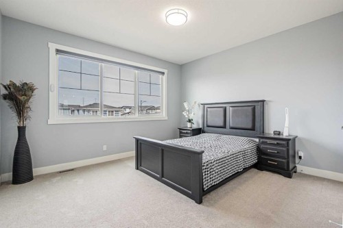 7 Waterford Heights, Chestermere, AB - Indoor Photo Showing Bedroom