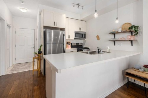 1403-279 Copperpond Common Se, Calgary, AB - Indoor Photo Showing Kitchen With Stainless Steel Kitchen With Double Sink