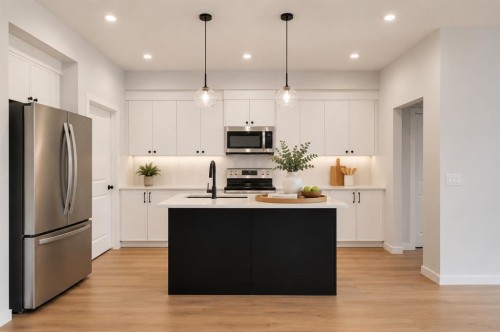 76 Heirloom Drive Se, Calgary, AB - Indoor Photo Showing Kitchen With Upgraded Kitchen