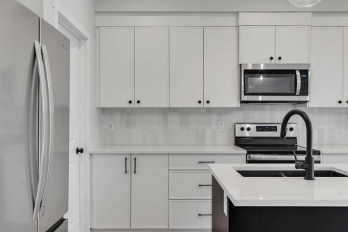 76 Heirloom Drive Se, Calgary, AB - Indoor Photo Showing Kitchen With Upgraded Kitchen