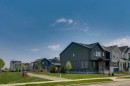 76 Heirloom Drive Se, Calgary, AB  - Outdoor With Facade 