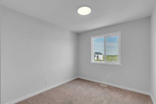 76 Heirloom Drive Se, Calgary, AB - Indoor Photo Showing Other Room
