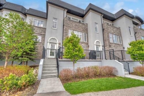 6 Quarry Gate Se, Calgary, AB - Outdoor With Facade