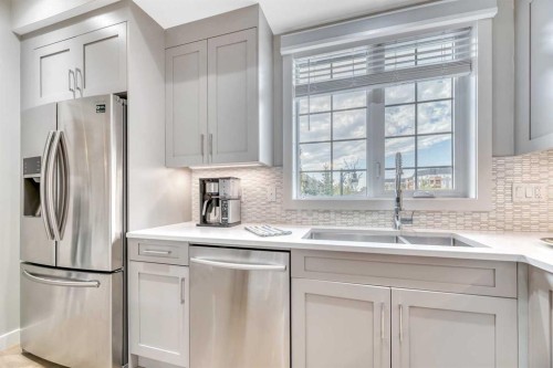 6 Quarry Gate Se, Calgary, AB - Indoor Photo Showing Kitchen With Stainless Steel Kitchen With Double Sink With Upgraded Kitchen