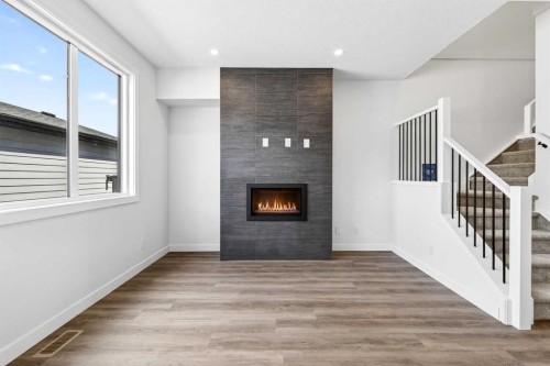 1109 Sailfin Heath, Rural Rocky View County, AB - Indoor With Fireplace