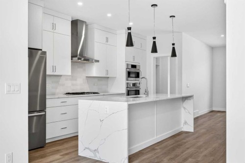 1109 Sailfin Heath, Rural Rocky View County, AB - Indoor Photo Showing Kitchen With Upgraded Kitchen