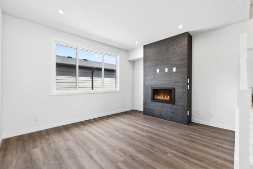 1109 Sailfin Heath, Rural Rocky View County, AB - Indoor With Fireplace