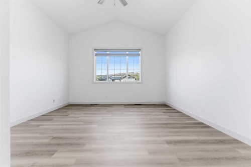 110 Tuscany Summit Green Nw, Calgary, AB - Indoor Photo Showing Living Room With Fireplace