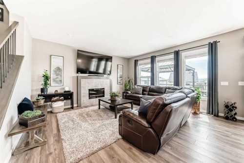 59 Heritage Heights, Cochrane, AB - Indoor Photo Showing Living Room With Fireplace