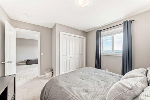 59 Heritage Heights, Cochrane, AB - Indoor Photo Showing Bedroom