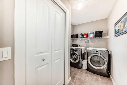 59 Heritage Heights, Cochrane, AB - Indoor Photo Showing Laundry Room
