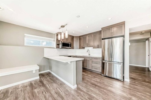 59 Heritage Heights, Cochrane, AB - Indoor Photo Showing Kitchen With Upgraded Kitchen