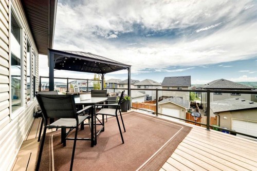 59 Heritage Heights, Cochrane, AB - Outdoor With Deck Patio Veranda With Exterior