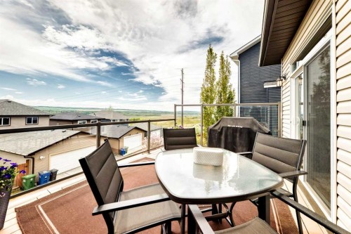59 Heritage Heights, Cochrane, AB - Outdoor With Deck Patio Veranda With Exterior