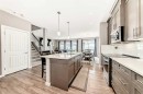 59 Heritage Heights, Cochrane, AB  - Indoor Photo Showing Kitchen With Upgraded Kitchen 