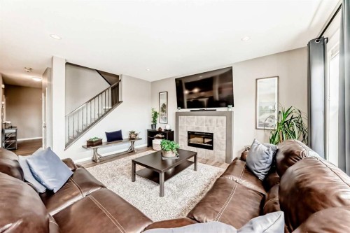 59 Heritage Heights, Cochrane, AB - Indoor Photo Showing Living Room With Fireplace