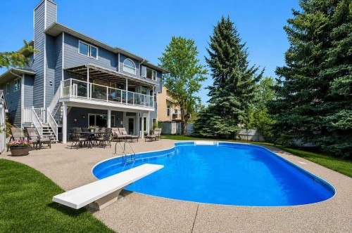 42 Evergreen Terrace Sw, Calgary, AB - Outdoor With In Ground Pool With Deck Patio Veranda