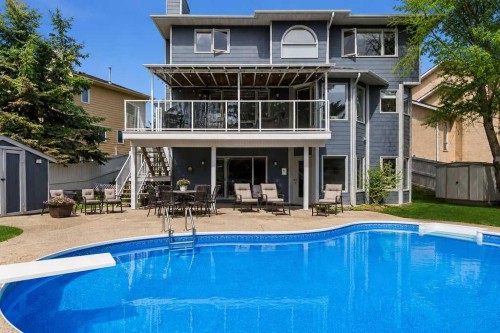 42 Evergreen Terrace Sw, Calgary, AB - Outdoor With In Ground Pool With Deck Patio Veranda
