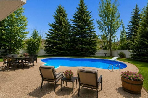 42 Evergreen Terrace Sw, Calgary, AB - Outdoor With Backyard