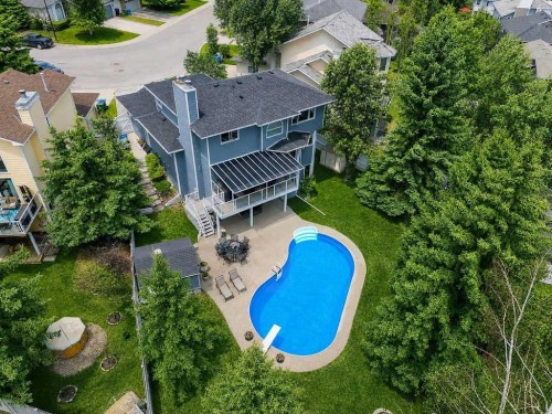 42 Evergreen Terrace Sw, Calgary, AB - Outdoor With In Ground Pool With Deck Patio Veranda