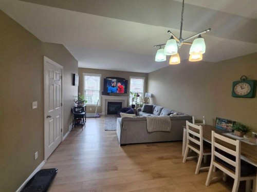 38-45 Ironstone Drive, Red Deer, AB - Indoor Photo Showing Living Room With Fireplace