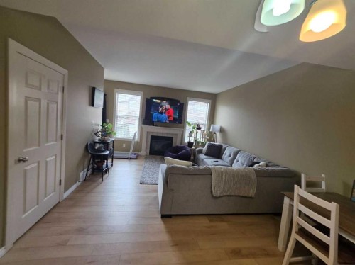 38-45 Ironstone Drive, Red Deer, AB - Indoor Photo Showing Living Room With Fireplace