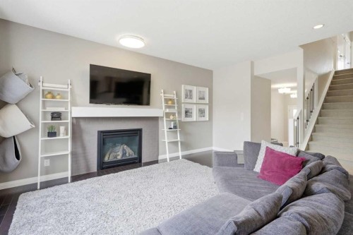 236 Auburn Springs Close Se, Calgary, AB - Indoor Photo Showing Living Room With Fireplace