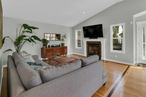 36 Rockyspring Rise Nw, Calgary, AB - Indoor Photo Showing Living Room With Fireplace