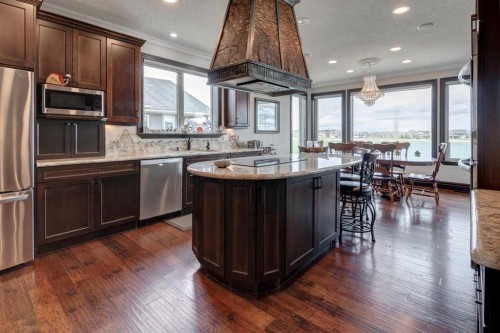31 Montenaro Bay, Cochrane Lake, AB - Indoor Photo Showing Kitchen With Upgraded Kitchen