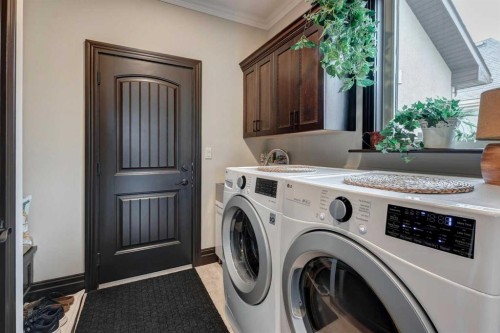 31 Montenaro Bay, Cochrane Lake, AB - Indoor Photo Showing Laundry Room